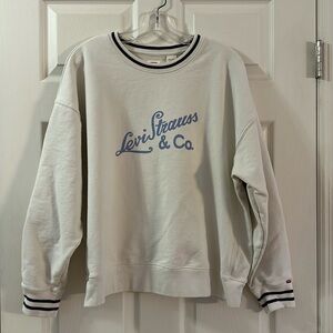Levi Strauss & Co. (XXL) Cream crewneck with Levi Strauss & Co in light blue.